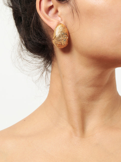 crystallized golden ovoid molten clip on earrings